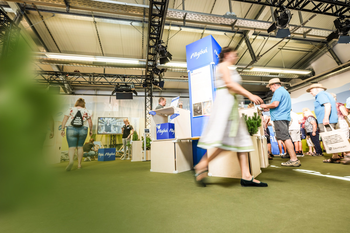 Visitors gather information at booths run by regional exhibitors at the Allgäu Festival Week.