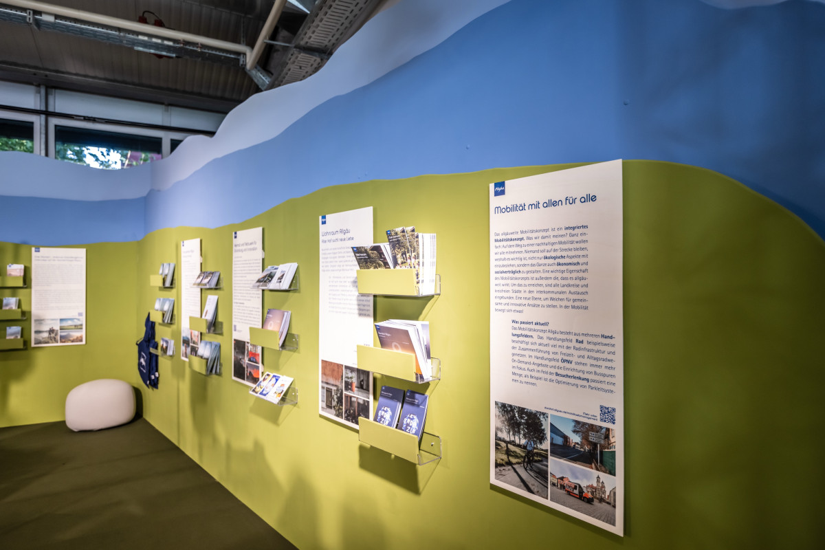 View of the Allgäu booth with flyer distribution.