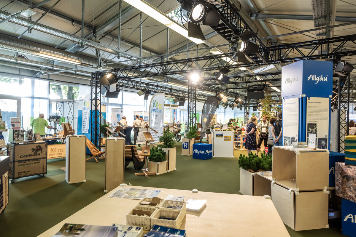 Lively festival-week atmosphere with encounters at the Allgäu booth.
