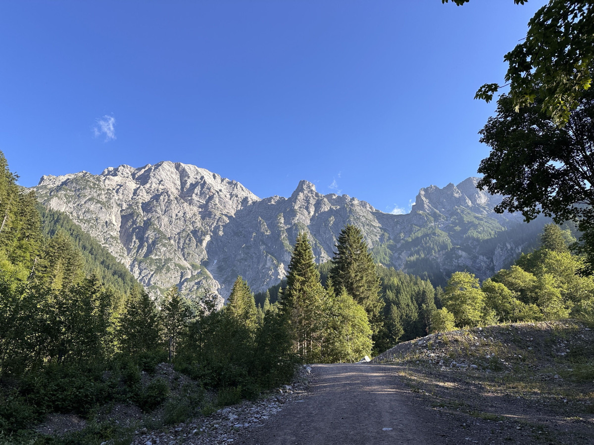 Mountain landscape with a hiking trail and alpine panorama.