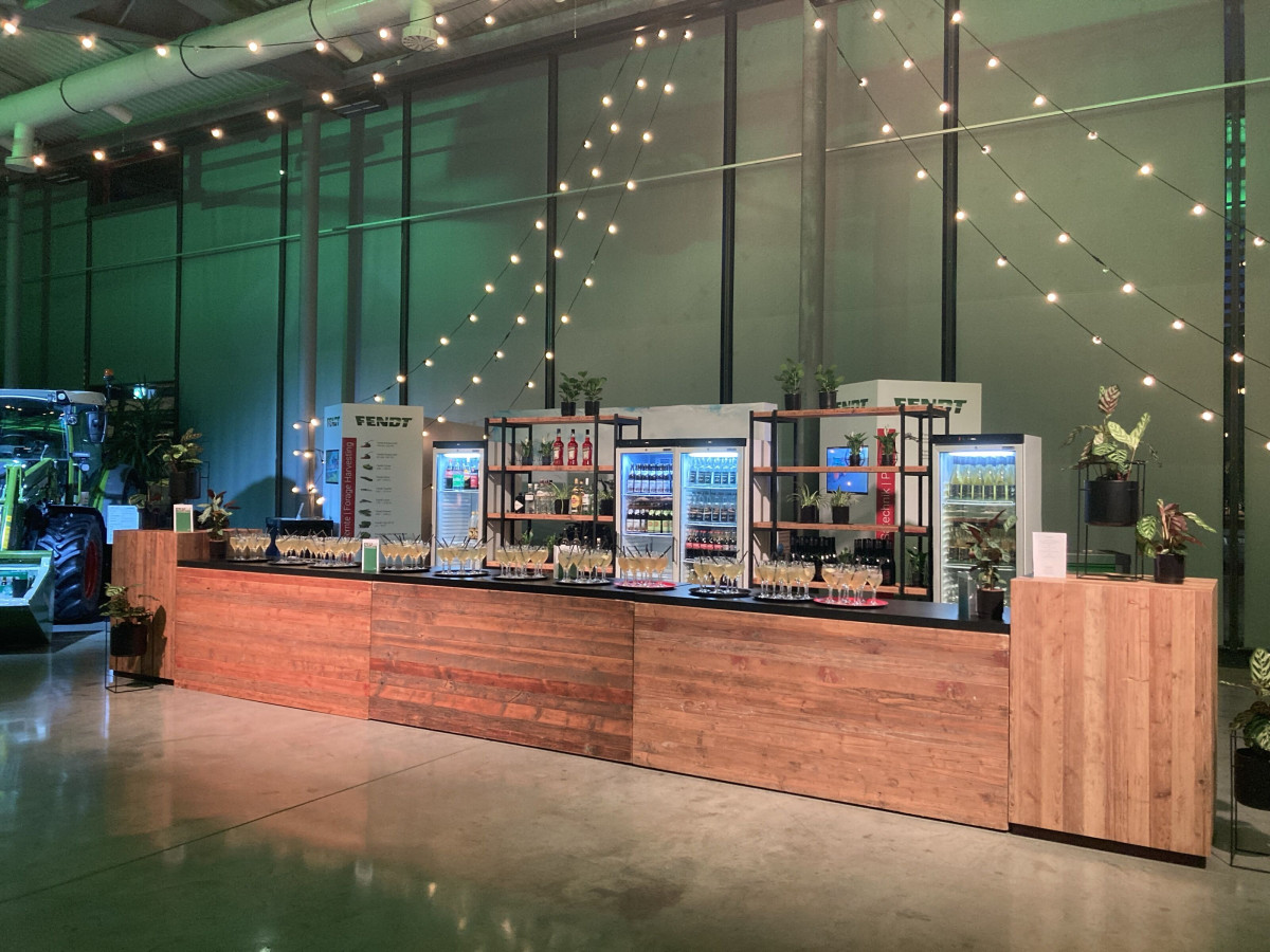Catering area with bar and drink refrigerators during the event.