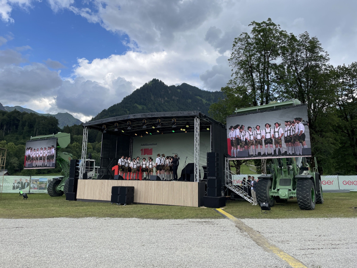Side view of the outdoor stage with LED screen and event technology.