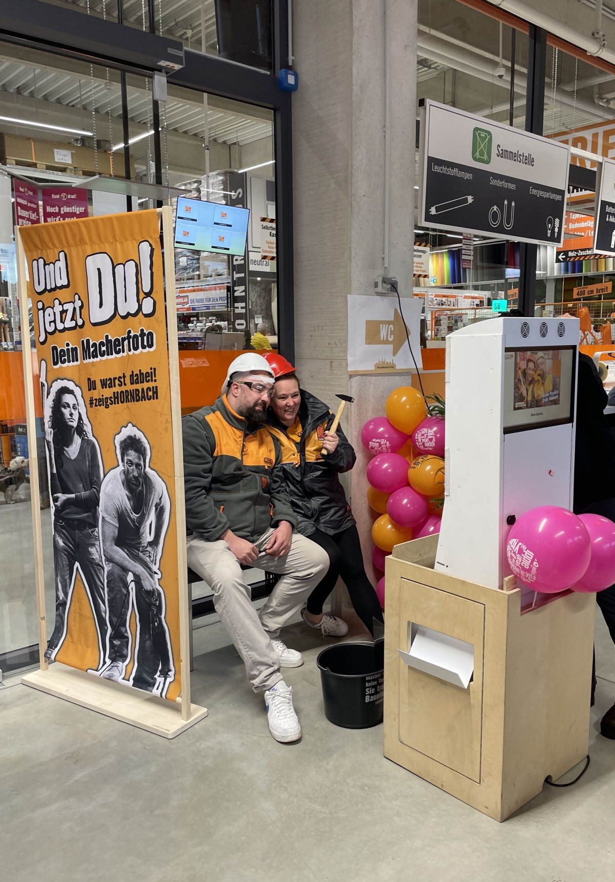 Visitor participating in an interactive activity during the HORNBACH store opening