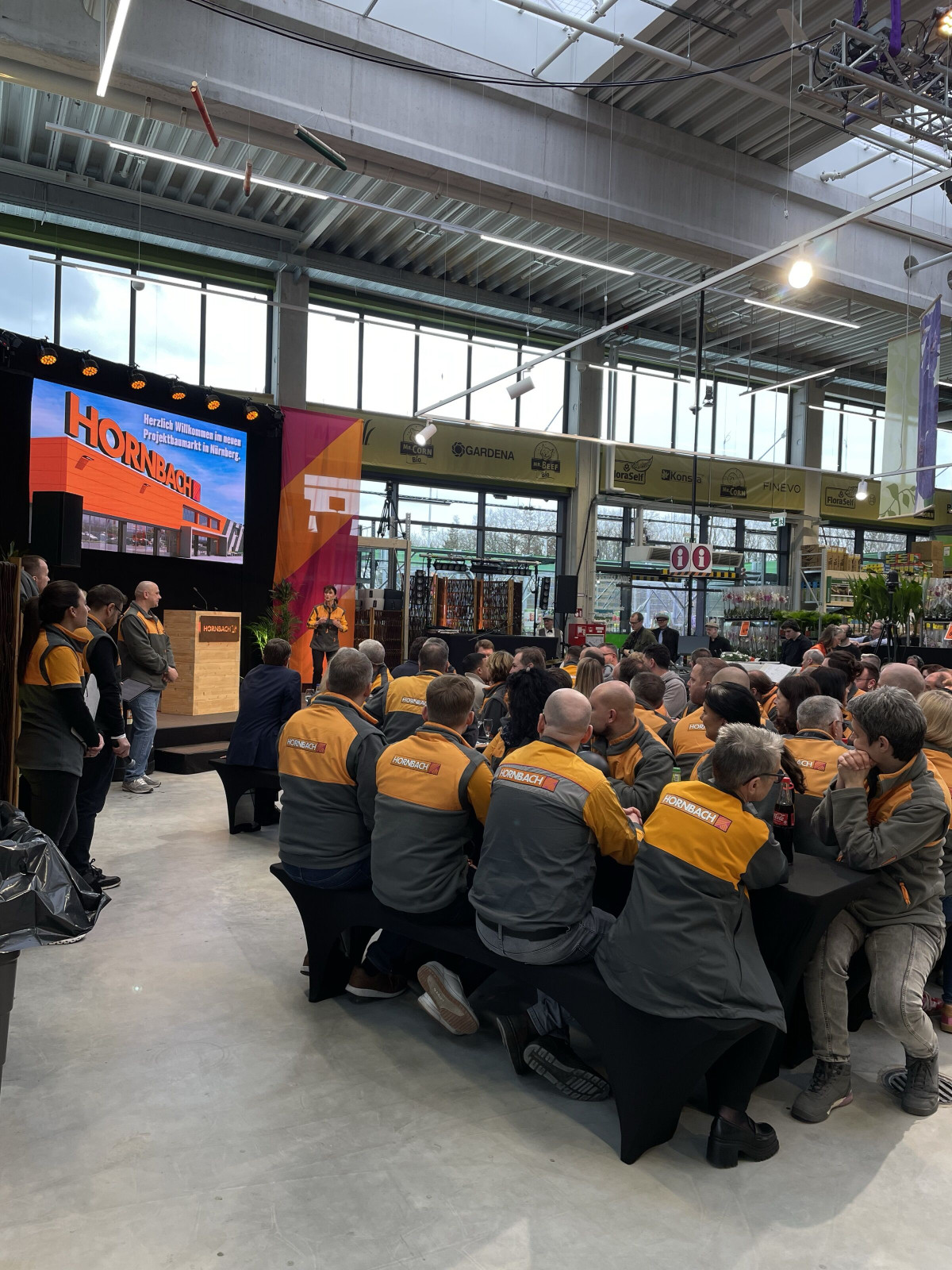 Audience listening to the opening ceremony at the HORNBACH st