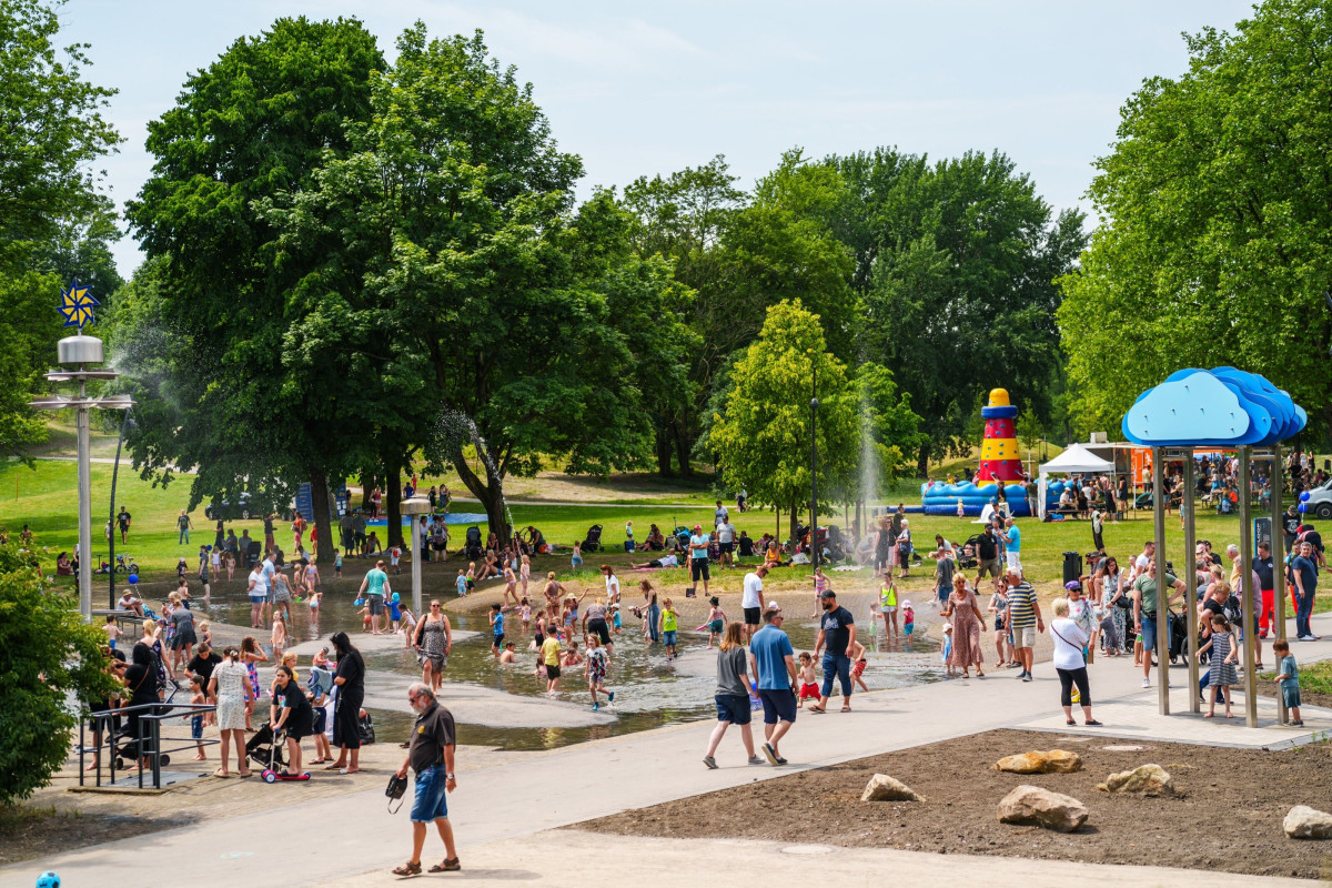 Visitors walk along the newly designed paths in the park.