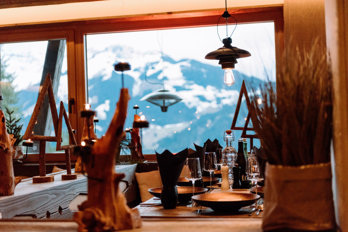 Detail shot of set tables overlooking the winter mountain landscape.